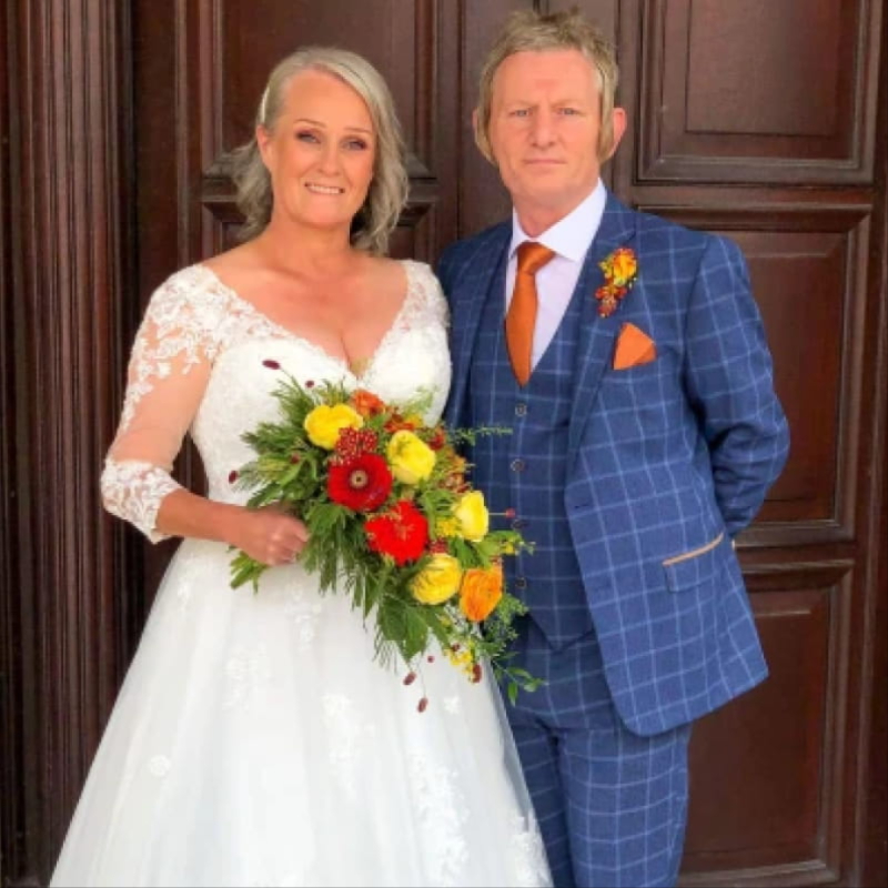 Bride with wedding flowers by Virginia Carmen Designs in Bolton