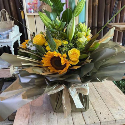 Your So Golden - A beautiful mix of Sunflower, Yellow Roses, Lillie's and other seasonal flowers

Please allow 1 working day when ordering this product.