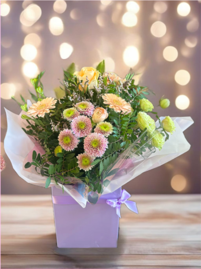 Pastel Petals - a selection of soft pastel blooms designed by your local florist in a pretty classic deisgn