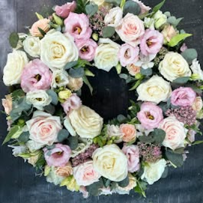 Wreath - A delicate funeral wreath in soft blush, cream and pastel tones.