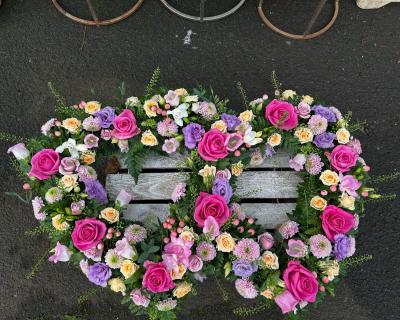 Double Heart - An elegant double-heart funeral tribute in pink, lilac and soft cream shades.